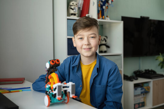 Young Enthusiast Building a Colorful Educational Robot
