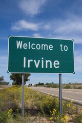 Welcome to Irvine, California - City Entrance Sign with Yellow Wildflowers and Blue Sky - Travel Destination, Southern California