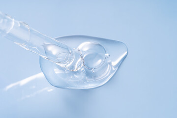 Transparent serum drops gently on a smooth surface