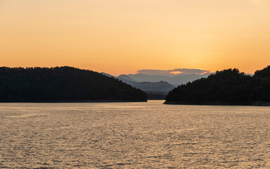 Naklejka premium summer sunset over the lake Pertusillo, Val d'Agri, Basilicata, Italy