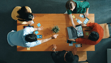 Programmer team brainstorm and plan Ux Ui design for mobile phone while present idea by using...