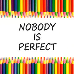 Nobody is perfect symbol. Concept words Nobody is perfect on beautiful white paper. Beautiful white background. Colored pencils. Business motivational lifestyle nobody is perfect concept. Copy space.
