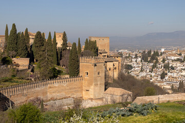 13th century Alcazaba fortress of Alhambra, Sierra Nevada mountains in background, Granada, Spain, Andalusia