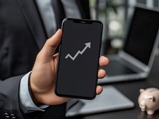 Businessperson holding a smartphone with an upward trend graph