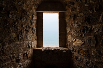Mystical Stone Corridor Illuminated by Light Through an Open window..