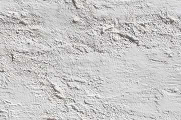 Fototapeta premium Whitewashed wall texture. Rough, uneven surface with subtle shadows.