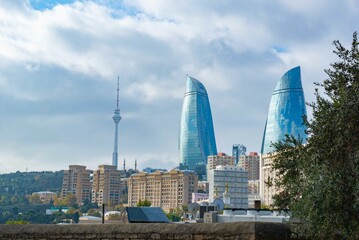 The modern landmark is visible from the old city of Baku