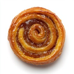 Fototapeta premium Shiny glazed spiral caramel pastry roll with golden flaky layers and sticky sweet coating