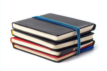 Stack of hardbound notebooks with colored elastic bands in black, red, and blue tones
