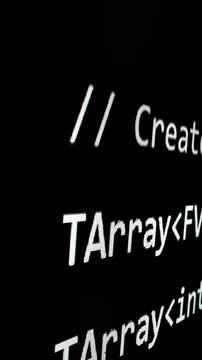 Closeup macro shot movement of coding script moving across LED screen with real-time AI-generated typing, showcasing advanced AI learning in optimization, debug and coding for software development.
