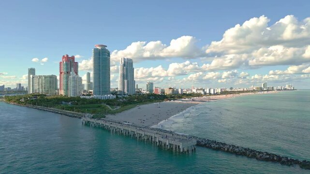 Summer in Miami from drone. Miami beach coastline. Panoramic view of Luxury condos in Miami Beach Florida. Aerial View of Surfside Miami Beach.