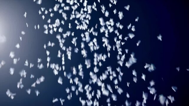 White starfall drifting against deep blue