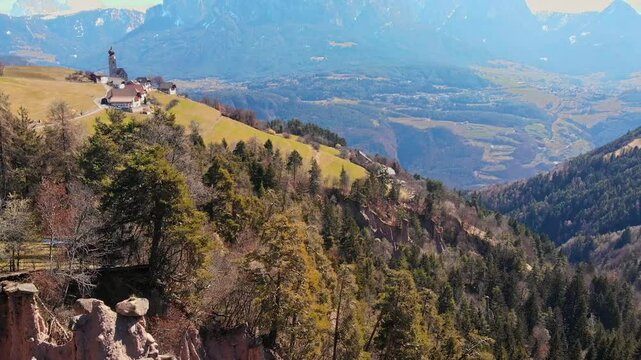 Dolomites landscape with natural earth pyramids or stone mushrooms in Dolomite mountains. Aerial view Renon South Tyrol, Italy.