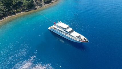 Luxurious White Yacht Anchored in a Tranquil Bay 