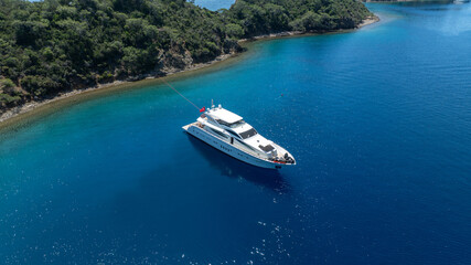 Luxurious White Yacht Anchored in a Tranquil Bay 