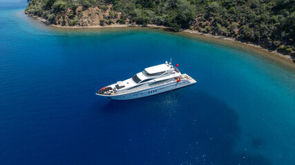 Luxurious White Yacht Anchored in a Tranquil Bay 