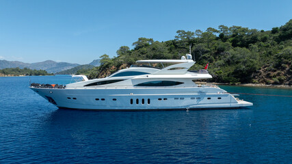 Elegant Luxury White Yacht Cruising in Crystal Clear Waters

