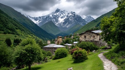 Fototapeta premium Ancient village nestled amid snowcapped mountains