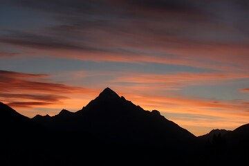 radiant dawn silhouette of mountain peak beauty  
