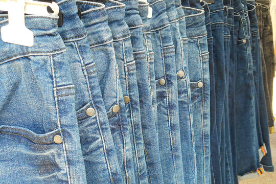 hangers with summer jeans for sale