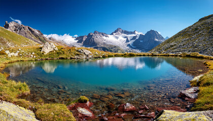 Fototapeta premium small glacier lake near lake trecolpas in the french alps