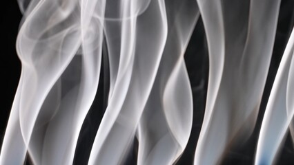 Abstract Swirling Patterns of White Smoke with Dark Background