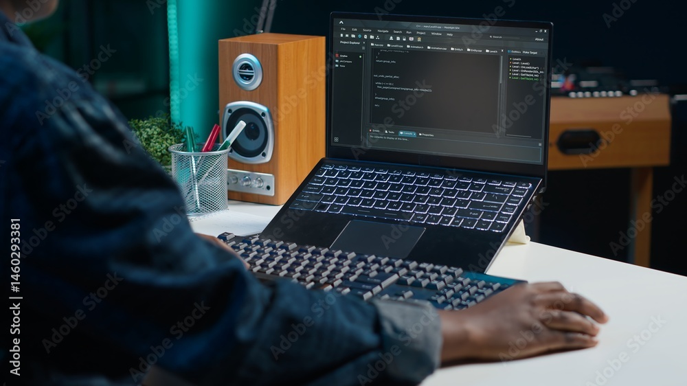 Poster teleworker in living room office using laptop to do coding for software developing, handheld camera 