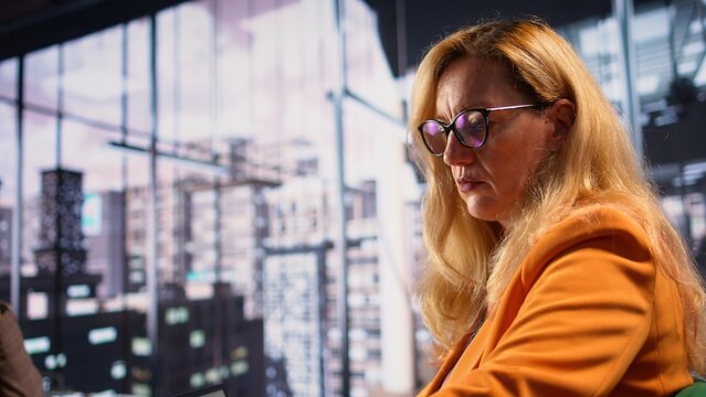 Distraught detached businesswoman suffers from depersonalization and derealization because of the workload and responsibilities. Entrepreneur emotionally disconnected from reality. Camera B.