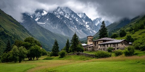 Fototapeta premium Remote village nestled amid verdant valleys snowcapped peaks