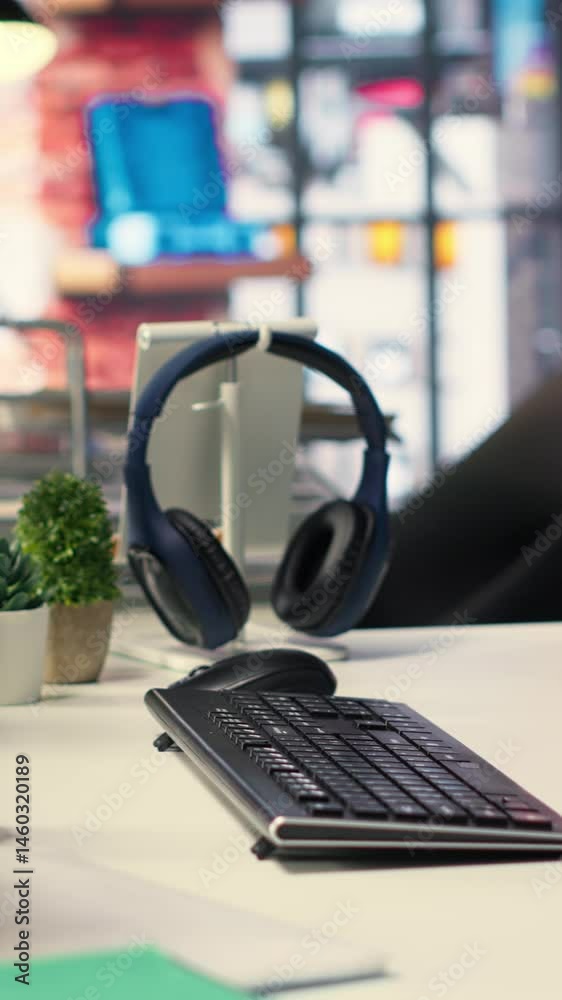 Poster vertical video empty ai developer desk including a monitor filled with neural network data, highligh