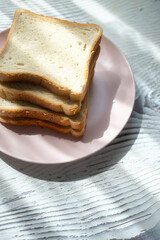 toast breads on pink plate in close-up