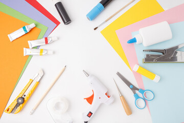 Craft supplies on white table ready for use in school projects, DIY tutorials, educational content, kids workshops, or stationery branding visuals for e-commerce and marketing,