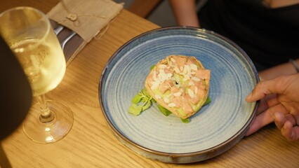 Hand Of The Waiter Leaving The Blue Dish For Dinner In The Restaurant 