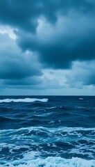 Fototapeta premium large body of water under a cloudy sky