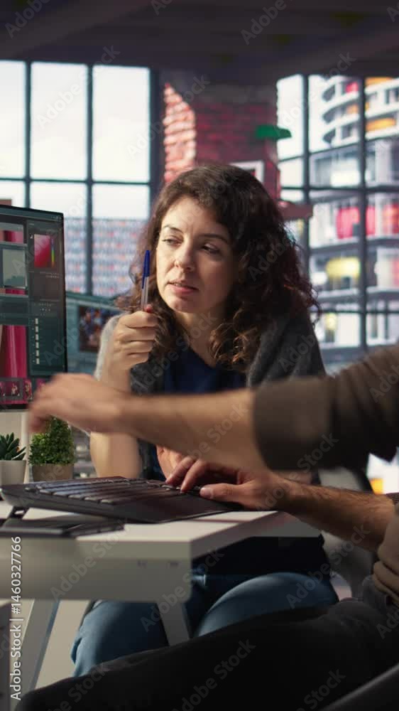 Poster vertical video creative team works with ai chatbot and editing software to improve content, applies 