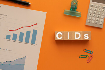 There is wood cube with the word CIDs. It is an abbreviation for Climatic impact-drivers as...