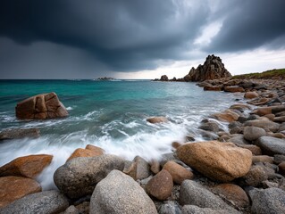 Obraz premium Stormy coast rocks turquoise sea threatening sky