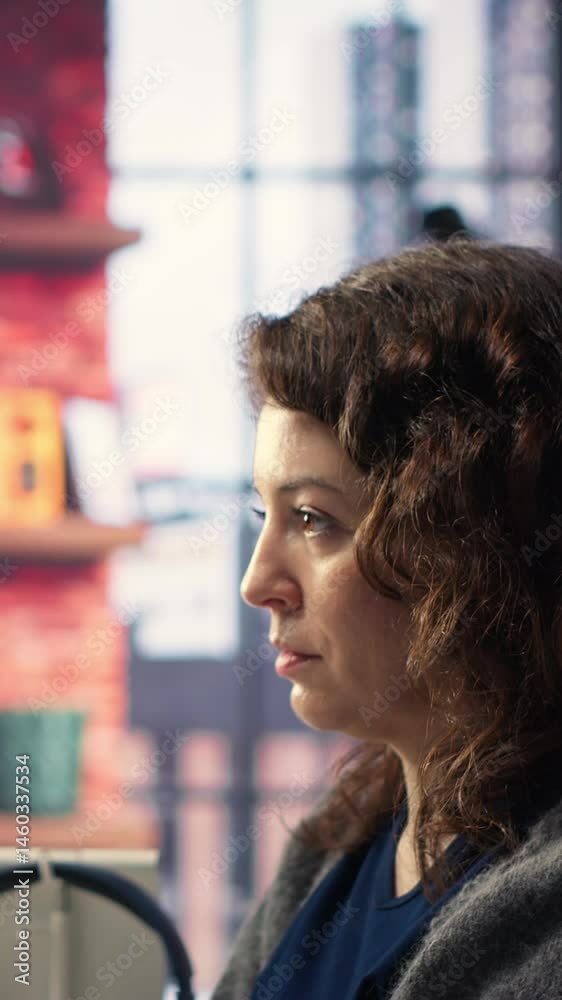 Fototapete Vertical Video Female programmer developing app and software algorithm on pc, working at creative agency. Engineer uses digital tools and focuses on java script engineering and coding, IT specialist