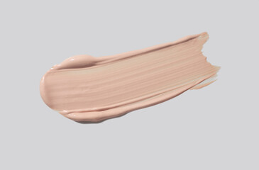 Liquid makeup concealer high lighter foundation, cc-cream wet finish sample swatch isolated on grey. Cosmetic beauty product