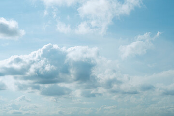 Beautiful sky blue clouds scattered throughout on nature background. Atmosphere clouds are white and fluffy, giving the sky a peaceful and serene appearance