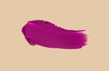 Cosmetic creamy liquid texture smudge fuchsia lipstick matte , gloss isolated on beige