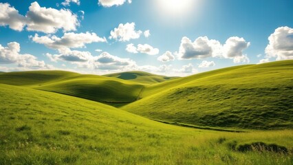 Fototapeta premium Lush green hills under partly cloudy sky with bright summer sunlight