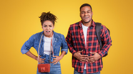 Black Travelers Couple Having Stomachache Suffering From Abdominal Pain After Food Poisoning On...