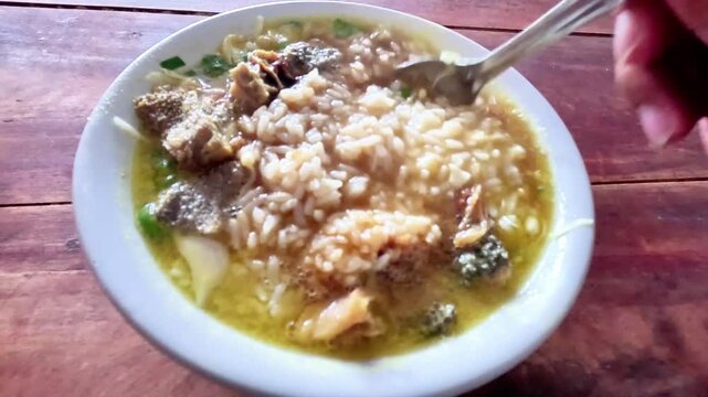 A plate of soto babad. Soto babad is an Indonesian beef soup with innards.