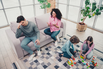 Family sad moments at home with parents and children interacting indoors