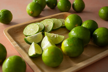 A view of a plate of sliced key limes.