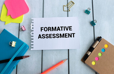 Formative Assessment text on a sheet of notepad near a cup of coffee.