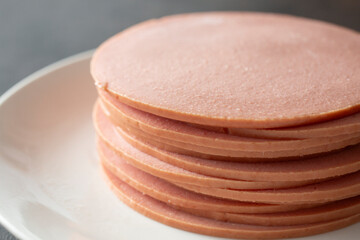 A view of a stack of bologna. © DAVID