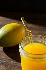 A view of a glass of mango juice.
