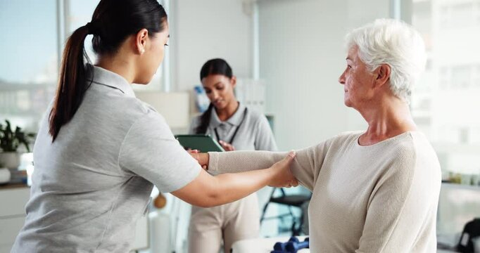 Senior woman, stretching and physiotherapist on tablet, injury progress and medical report. Elderly patient, helping and physiotherapy team with mobility assessment, rehabilitation and healing muscle